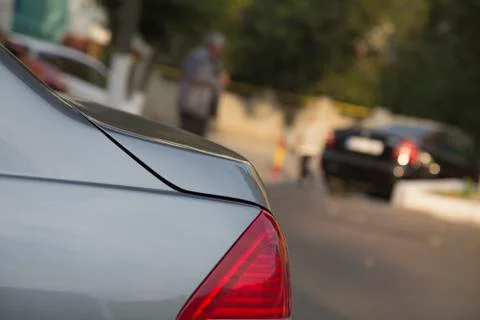 Wing and stoplight of a car. Fotos Stock