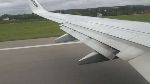 Wing of a fast moving and taking off plane Stock-Footage 115709525