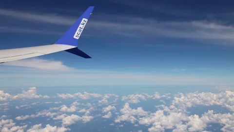 Wing flying in the blue sky with clouds Stock Footage 241976845
