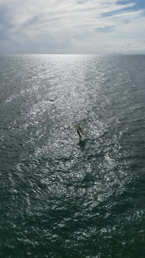 Wing Foiling Athlete Gliding on Open Water in Tuscany, Italy Stock Footage 335818912