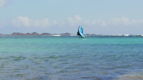 Wing Foiling at Playa de los Verilitos Corralejo, Lobos Island in the distance Stock Footage 301652766