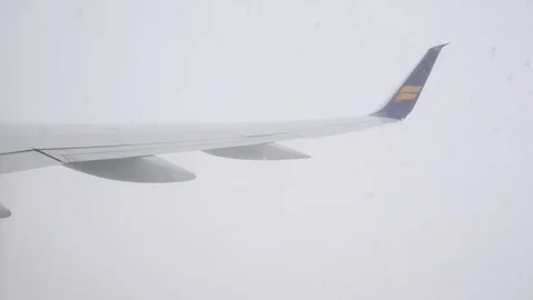 Wing of Icelandair plane in clouds Stock Footage 122767546