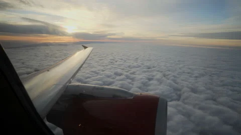 Wing of the Jet plane in the sky at the sunset Stock Footage 98246105