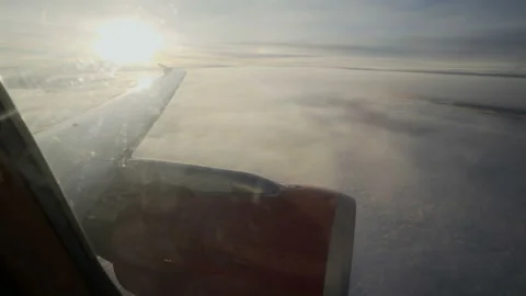 Wing of the Jet plane in the sky at the sunset Stock Footage 98246664