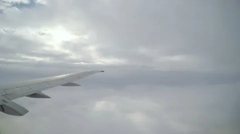 Wing of passenger airplane - the view through the window Stock Footage 61527787