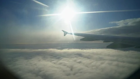 Wing of plane. Airplane window. Wing of airplane from window. Airplane flight Stock Footage 89728399