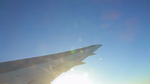 Wing of the plane in the blue sky Stock Footage 143349744