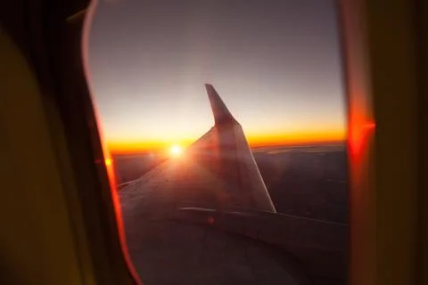 Wing of the plane on blue sky Stock Photos