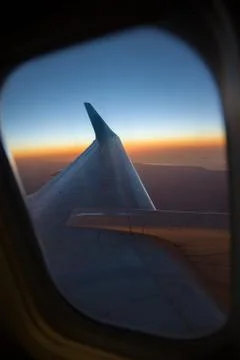 Wing of the plane on blue sky Stock Photos