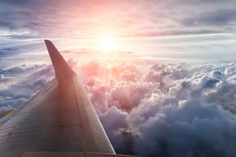 Wing of the plane on blue sky Stock Photos