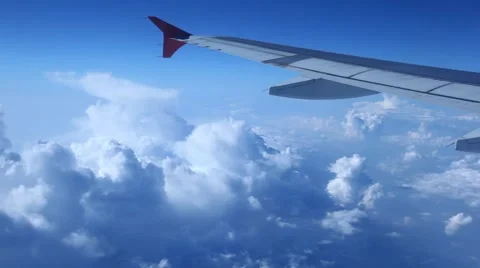 Wing of plane close up against the blue sky Stock Footage 6373415