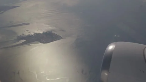 Wing of Plane Flying Above the Coast of the Pacific Ocean Stock Footage 148689262