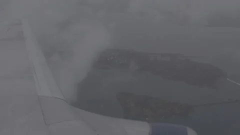 Wing of Plane Flying through the Clouds Video stock 154005708
