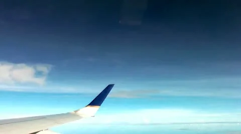 Wing of Plane, Passenger Jet, Clouds Video stock 12384223