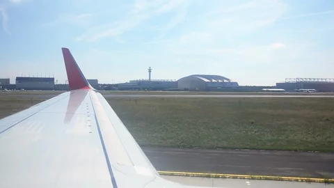The wing of the plane from the porthole Stock Footage 94977867