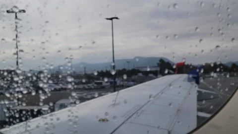 Wing Of Plane on a rainy day Stock Footage 236427610