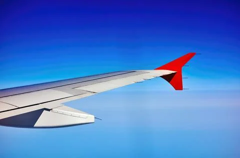 The wing of the plane on sky background Stock Photos