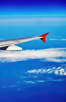 The wing of the plane on sky background Stock Photos