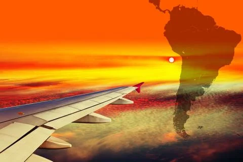 Wing of the plane at sunset Stock Photos