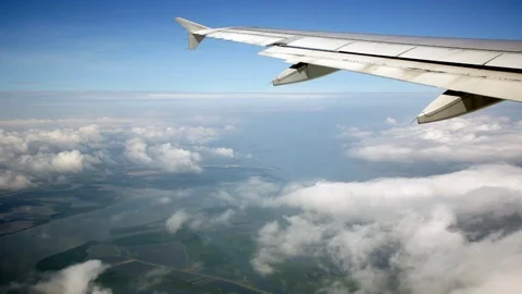 Wing seen trough an airplane window Stock Footage 118194358