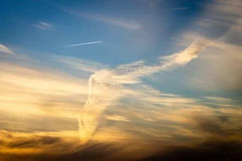 Wing Shape in the Sky at Sunset Stock Photos