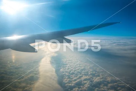 The wing in the sky on the background of the cloud Stock Photos