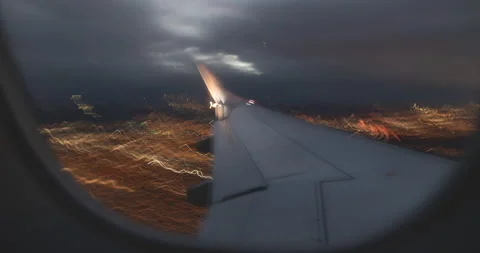 Wing time lapse of plane flying and landing at the airport Stock Footage 169450294