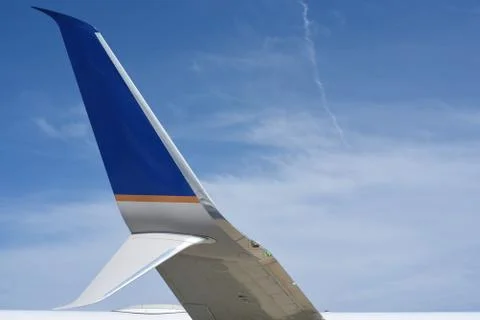 Wing tip, winglet, and scimitar of a commercial airplane Stock Photos