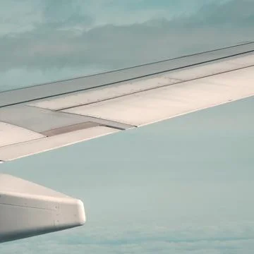 Wing view above clouds Stock Photos