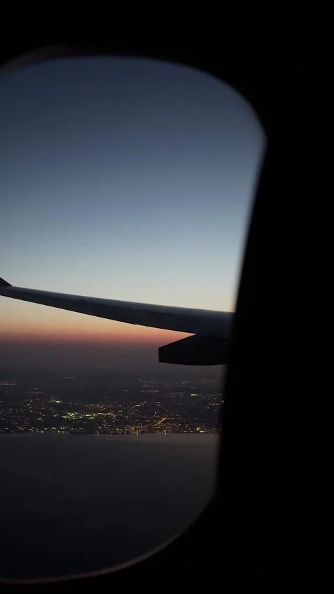 Wing view, night flight on an airplane, view of a endless night sky through the Stock Footage 329558996