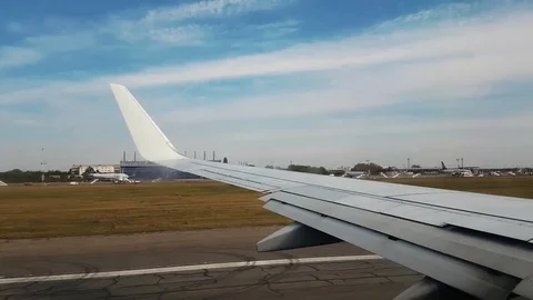 Wing view of a plane taking off Stock Footage 82393812