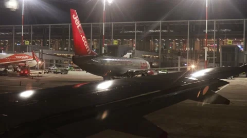 Wing View while taxiing at Dalaman Airport.  Airport Building 4K Canon R5 Stock Footage 222015891