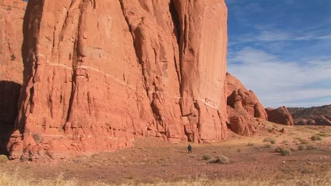 Wingate Cliffs with male walking at Red Rock Park in Gallup, New Mexico USA Stock Footage 103550883