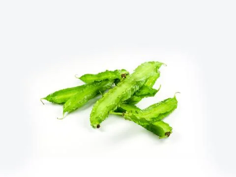 Winged beans on white background isolate. Vegetables to eat with chili paste. Stock Photos