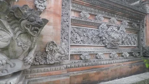 Winged Lion or Demon Statue, Bas Reliefs on Temple Wall, Ubud, Bali, Indonesia Stock Footage 286051640