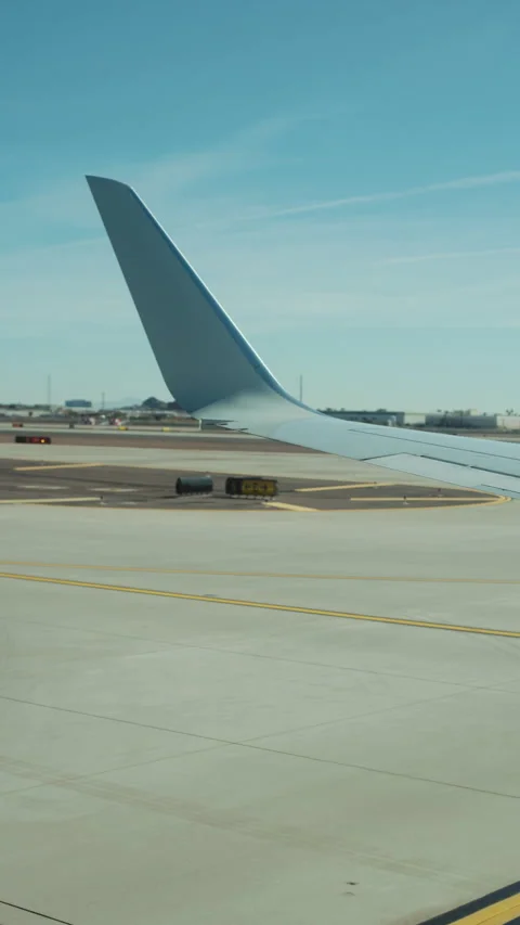 Winglet against blue sky while taxiing at the airport vertical Stock-Footage 347965604