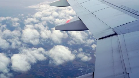 On the wings of an airplane above the clouds beautiful. Airplane flight 4K Stock Footage 121735331
