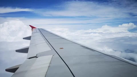 Wings of the airplane during the flight look from the passenger window 스톡 동영상 283066196