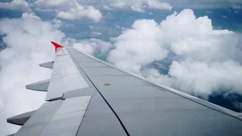 Wings of the airplane during the flight look from the passenger window Video stock 283068716