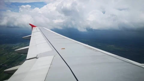 Wings of the airplane during the flight look from the passenger window Video stock 283068954