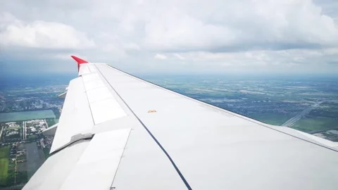 Wings of the airplane during the flight look from the passenger window Video stock 283069267