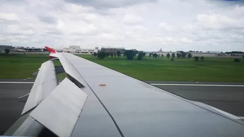 Wings of the airplane during the flight look from the passenger window Video stock 283070526