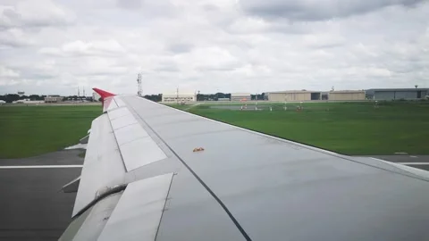 Wings of the airplane during the flight look from the passenger window Video stock 283070528