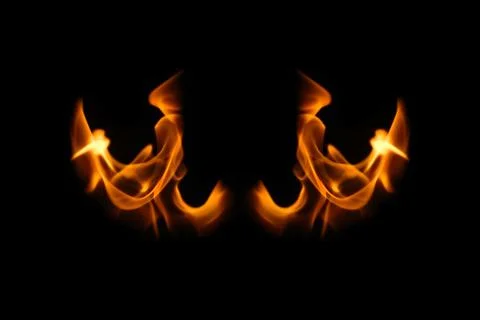 Wings in flame. Wings in Flame and Fire. Black background. Copy space. Out of Stock Photos