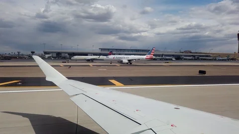 Wingside view of Plane taking off from Phoenix, Arizona Airport Stock Footage 107453360