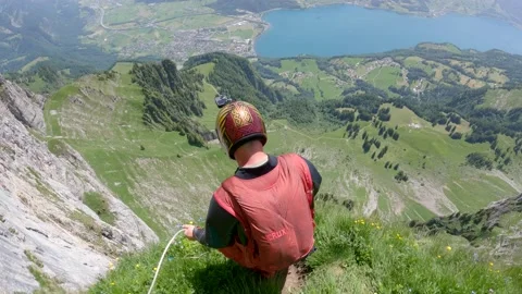 Wingsuit BASE Jump at Sputnik, 'The Crack', Walenstadt, Switzerland - 19 Jun 202 Stock Footage 217295776