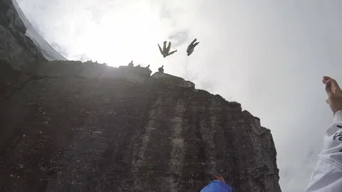 Wingsuit Jumper Flies Down Cliffside 스톡 동영상 79733871