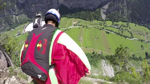 Wingsuit Jumper Jumps Down Cliff Wall 스톡 동영상 79740863