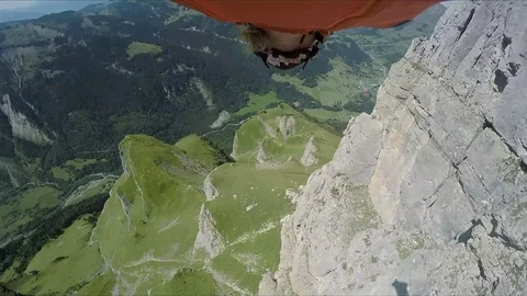 Wingsuit Skydive from mountain, Switzerland Stock Footage