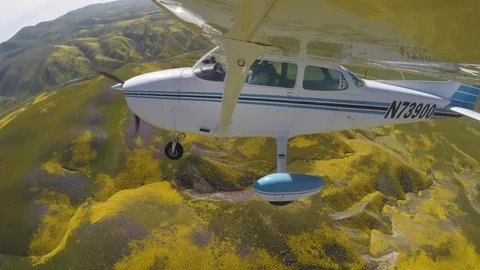 Wingtip View Small Airplane Over Superbloom Stock Footage 119727798